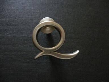 q lapel pin