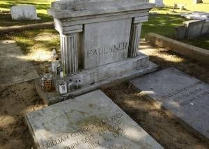 Fauikner's grave, complete with bourbon bottles.  Photo by Alysia Burton Steele