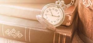 pocket clock over old books