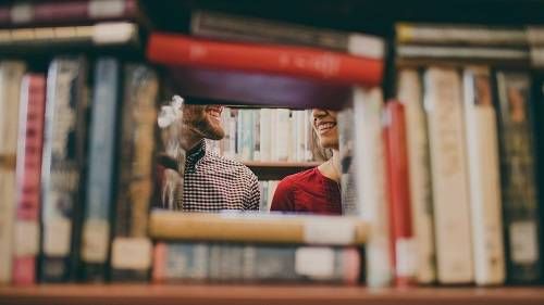 smiling in the library by josh felise