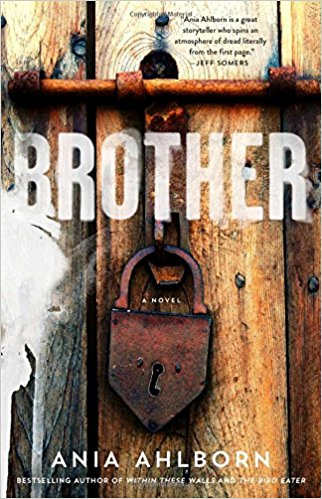 cover of brother ania ahlborn, featuring a wooden door with a large rusted padlock on it