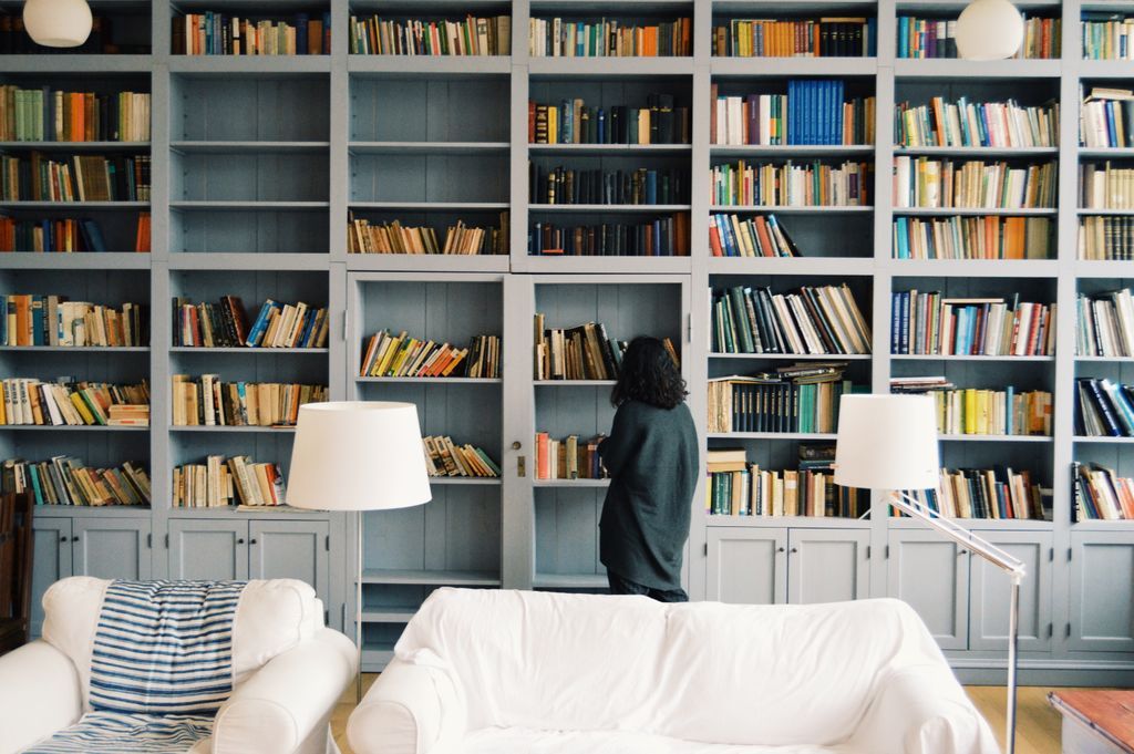 Woman looking at shelf of books