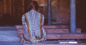 non-readers back turned solitary woman avoiding book feature