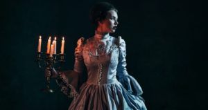 victorian woman holding candelabra historical fiction mystery thriller and crime feature