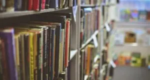 image of books on a shelf at a library