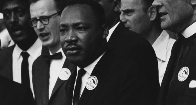 Source: https://en.wikipedia.org/wiki/Martin_Luther_King_Jr.#/media/File:Civil_Rights_March_on_Washington,_D.C._(Dr._Martin_Luther_King,_Jr._and_Mathew_Ahmann_in_a_crowd.)_-_NARA_-_542015_-_Restoration.jpg