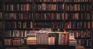 photo of a bookstore with a table full of book stacks