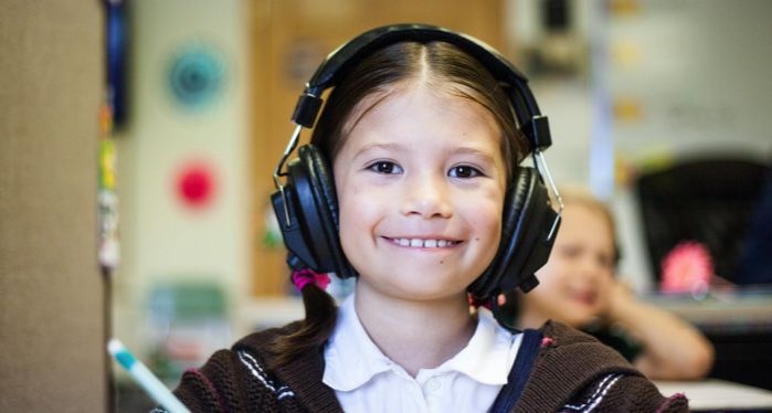 a photo of a kid wearing headphones