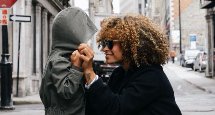 image of a smiling woman crouching in front of a child https://unsplash.com/photos/httxBNGKapo