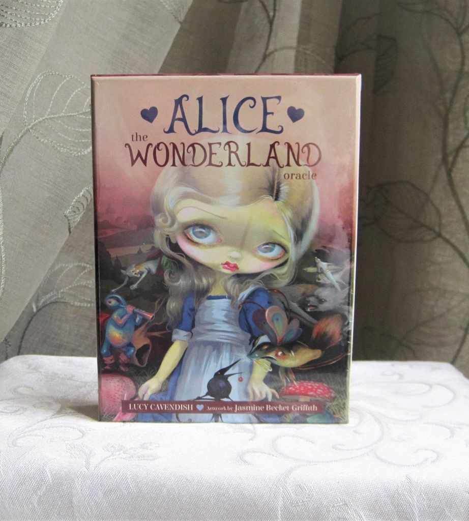 The box cover of the Alice Wonderland oracle cards