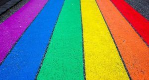 rainbow-colored stripes painted on a road