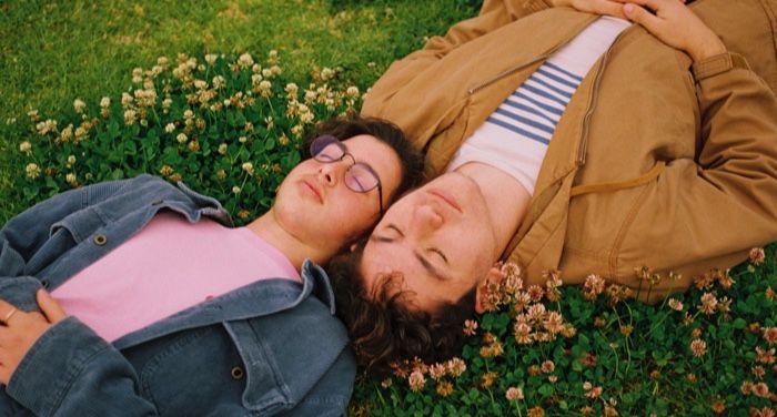 gay couple in a field of flowers