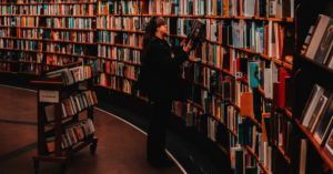 woman browsing books in a library