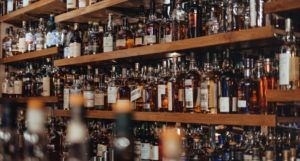 image of bottles of spirits at a hotel bar https://unsplash.com/photos/6UIonphZA5o