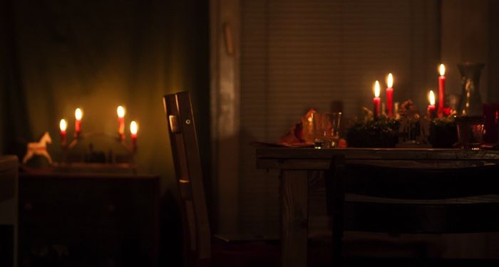 empty chair at christmas dinner table