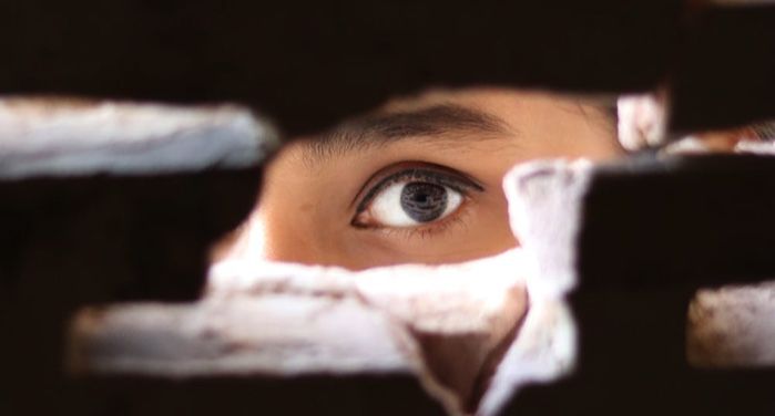 image of a person peeking through a hole https://www.pexels.com/photo/photo-of-person-peeking-through-the-hole-3820281/