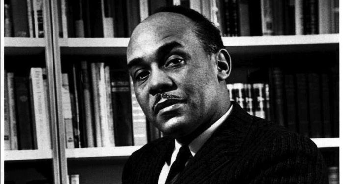 black and white image of Ralph Ellison https://en.wikipedia.org/wiki/Ralph_Ellison#/media/File:Ralph_Ellison_photo_portrait_seated.jpg