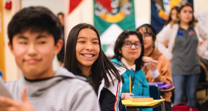 a photo of kids or teens in a classroom at school