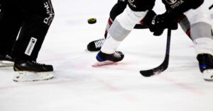 knee down image of hockey players playing hockey