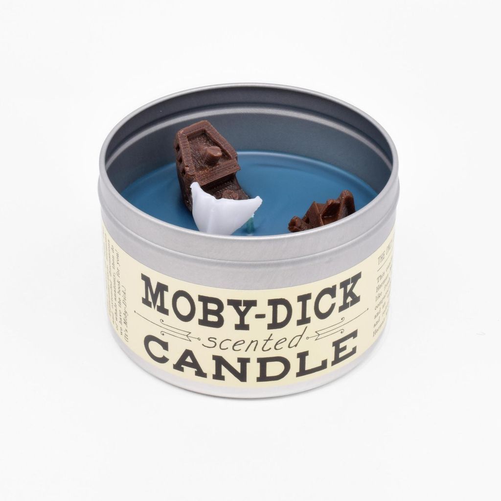 Moby Dick candle, with a whale and wrecked ship sticking out of the wax