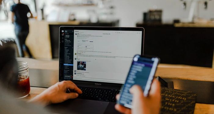 person using phone and laptop at the same time https://unsplash.com/photos/gUIJ0YszPig