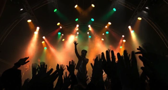 silhouette of people at a concert