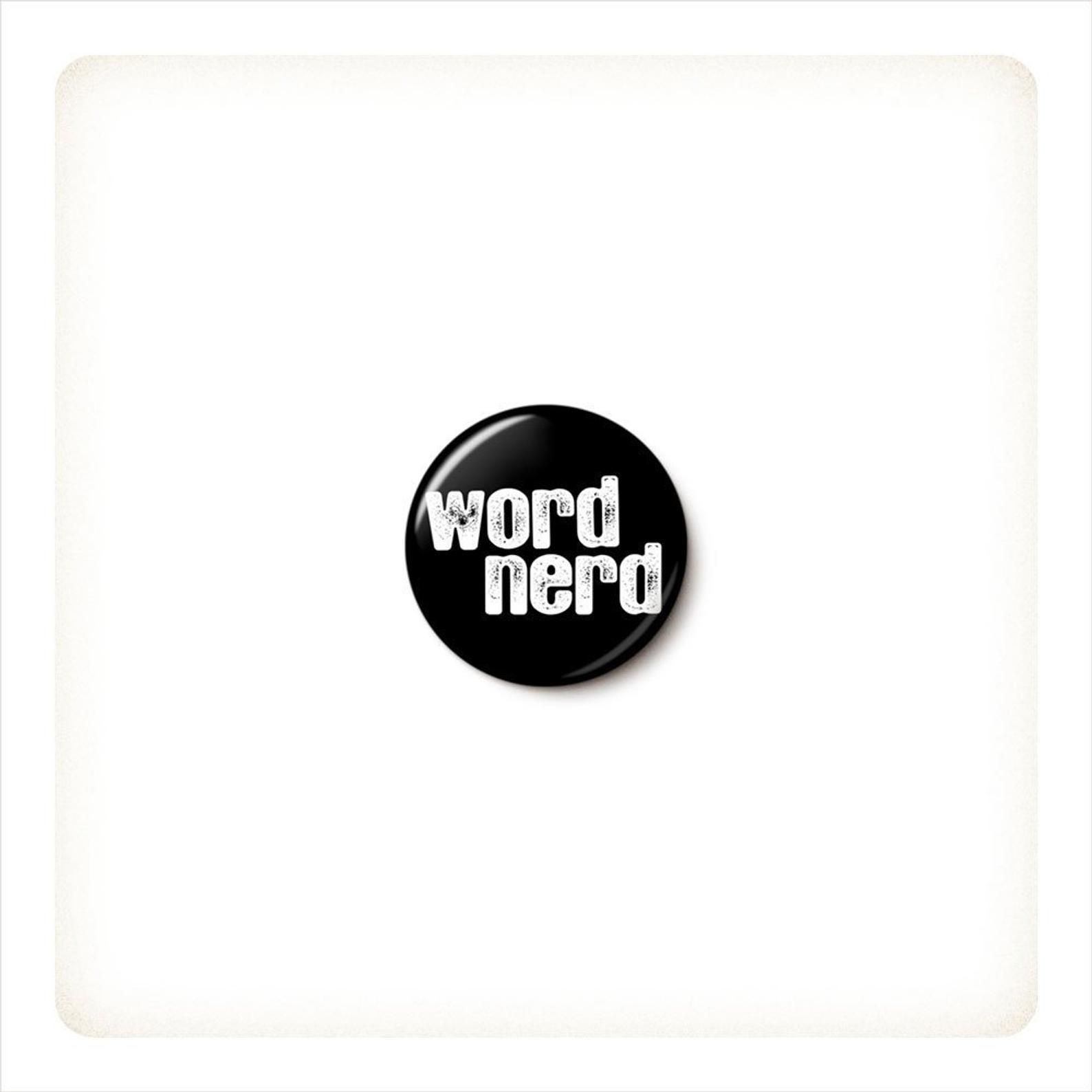 A black pin that reads "word nerd" in white lettering.