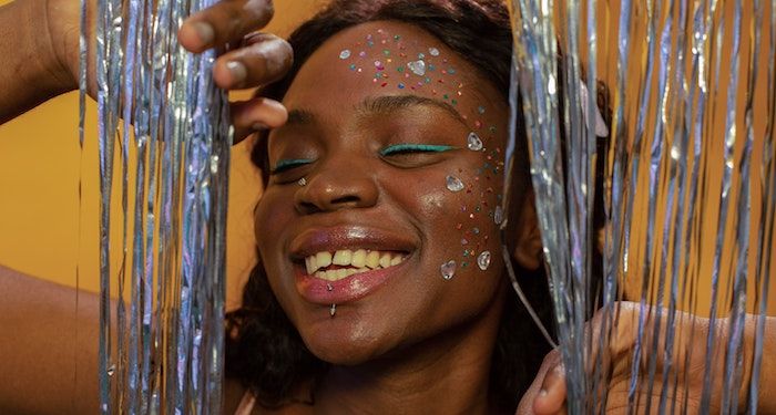 Black woman with stickers on face