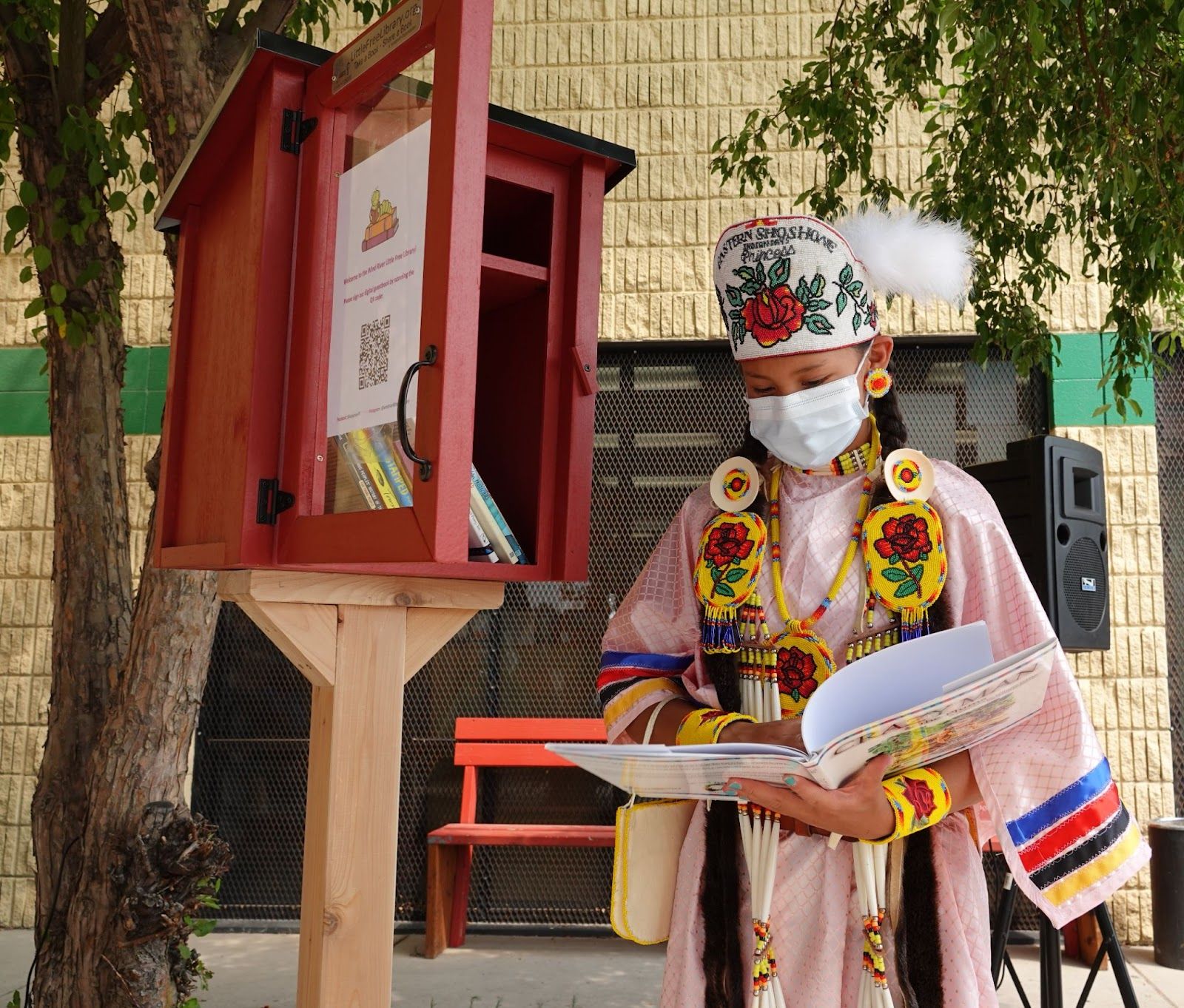 Image of Eastern Shoshone Indian Days Princess Janae Todd, with the new Little Free Library. Image provided by Little Free Library.