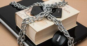 chained book and laptop