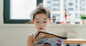 a young girl reading