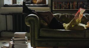 reading books on a couch
