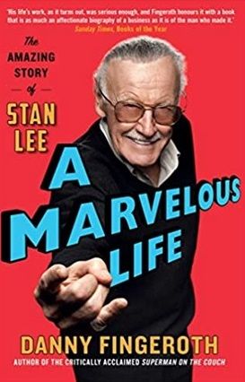 An image of Stan Lee smiling and pointing at the reader