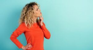 blue background with a woman with a confused expression