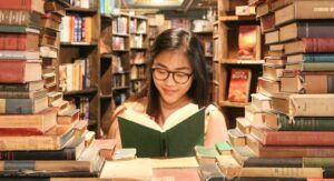 image of an asian woman reading a book