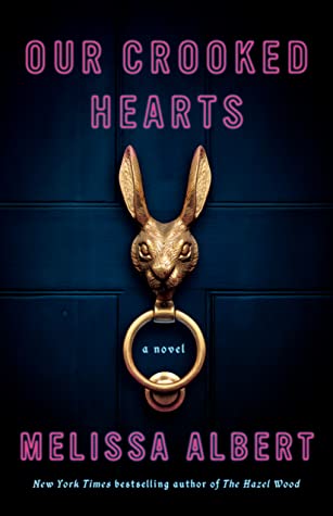 cover of Our Crooked Hearts by Melissa Albert, image of a dark blue door with a gold rabbit door knocker and neon pink font