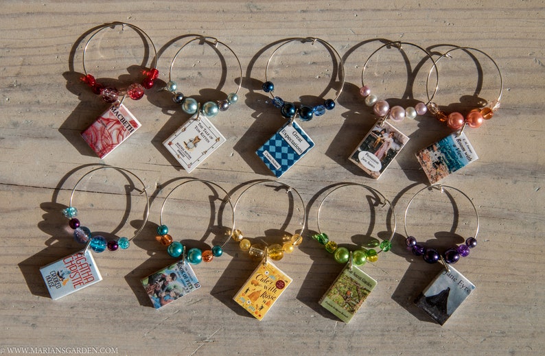 Individual charms with different coloured beads and tiny book covers