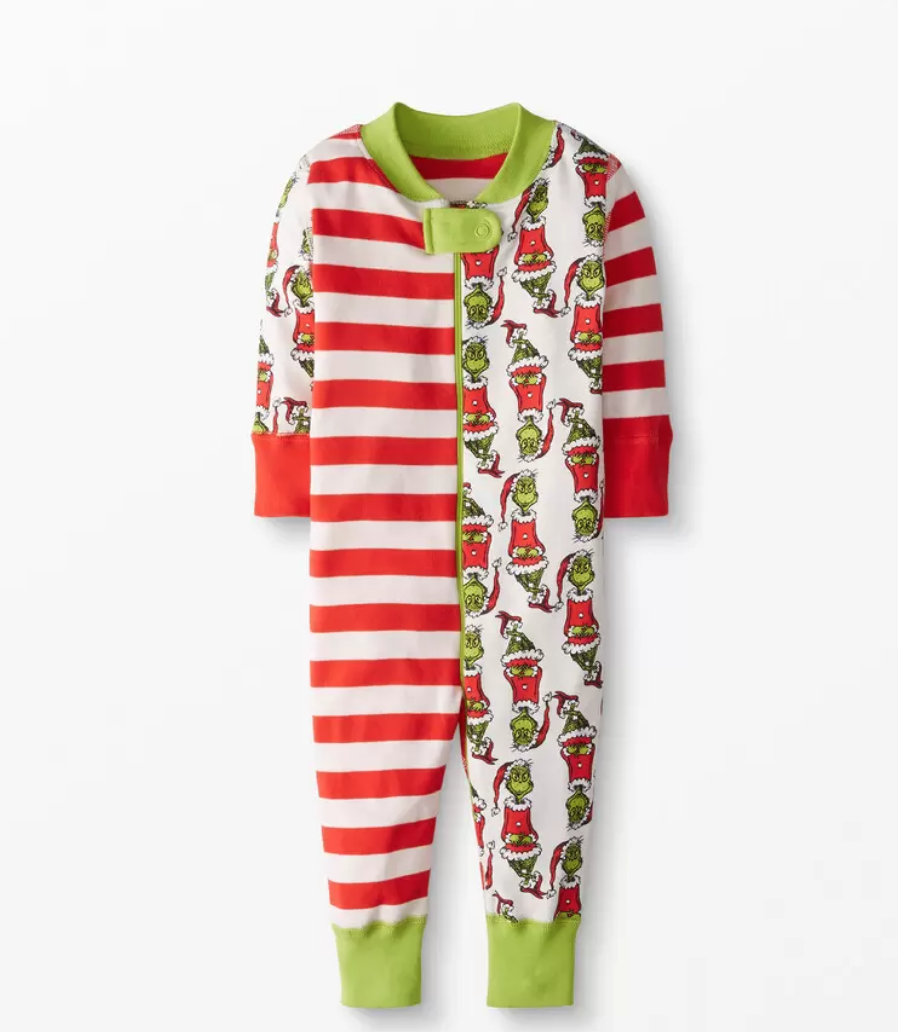 A child's sleeper with red and white stripes and motifs of Dr. Suess's the Grinch.