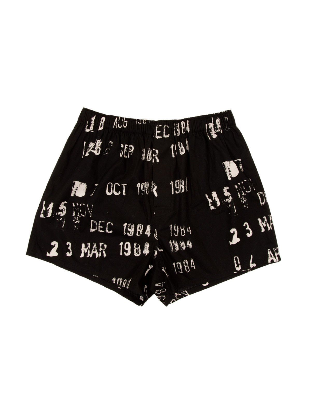 Black boxer shorts with a pattern of library stamp due dates