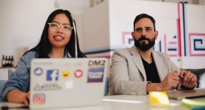 image of man and woman sitting in a meeting