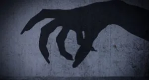 shadow of a creepy hand with claws