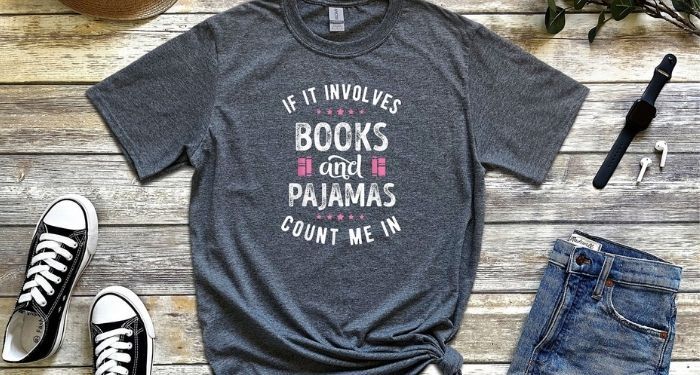 image of a gray shirt reading "if it involves books and pajamas count me in'