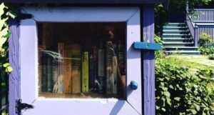 a purple little free library