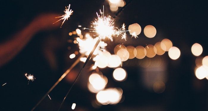 a photo of sparklers at night