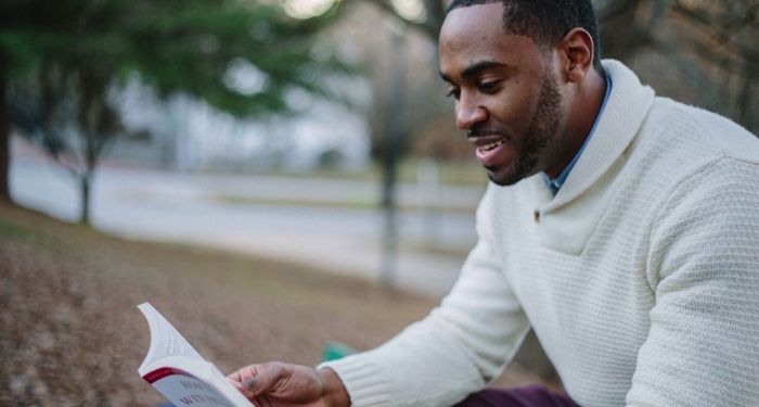 Black man reading