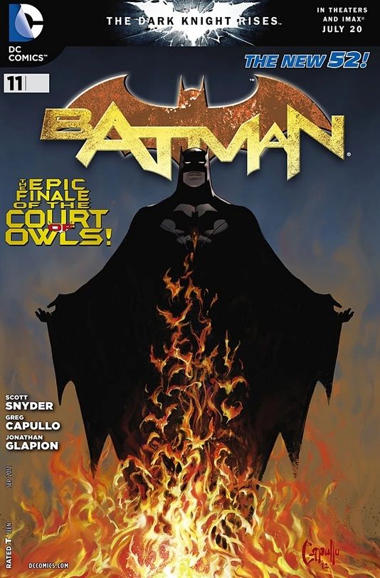 Batman #11 cover. Batman stands with his cape spread, fire at his feet rising in the shape of bats before him.