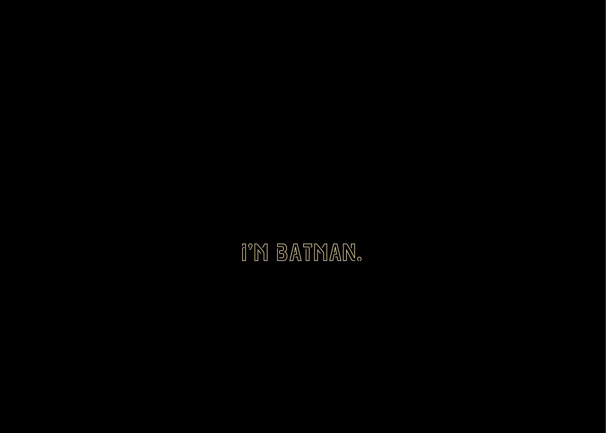 black background with yellow neon reading "I'm Batman."