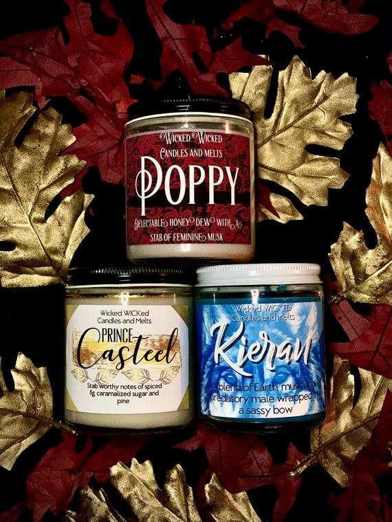 Photo of three From Blood and Ash character scented candles