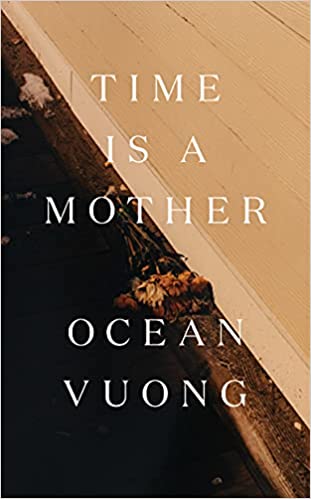 cover of Time Is a Mother by Ocean Vuong, a photo of a dying bouquet of flowers lying on the pavement next to a white building