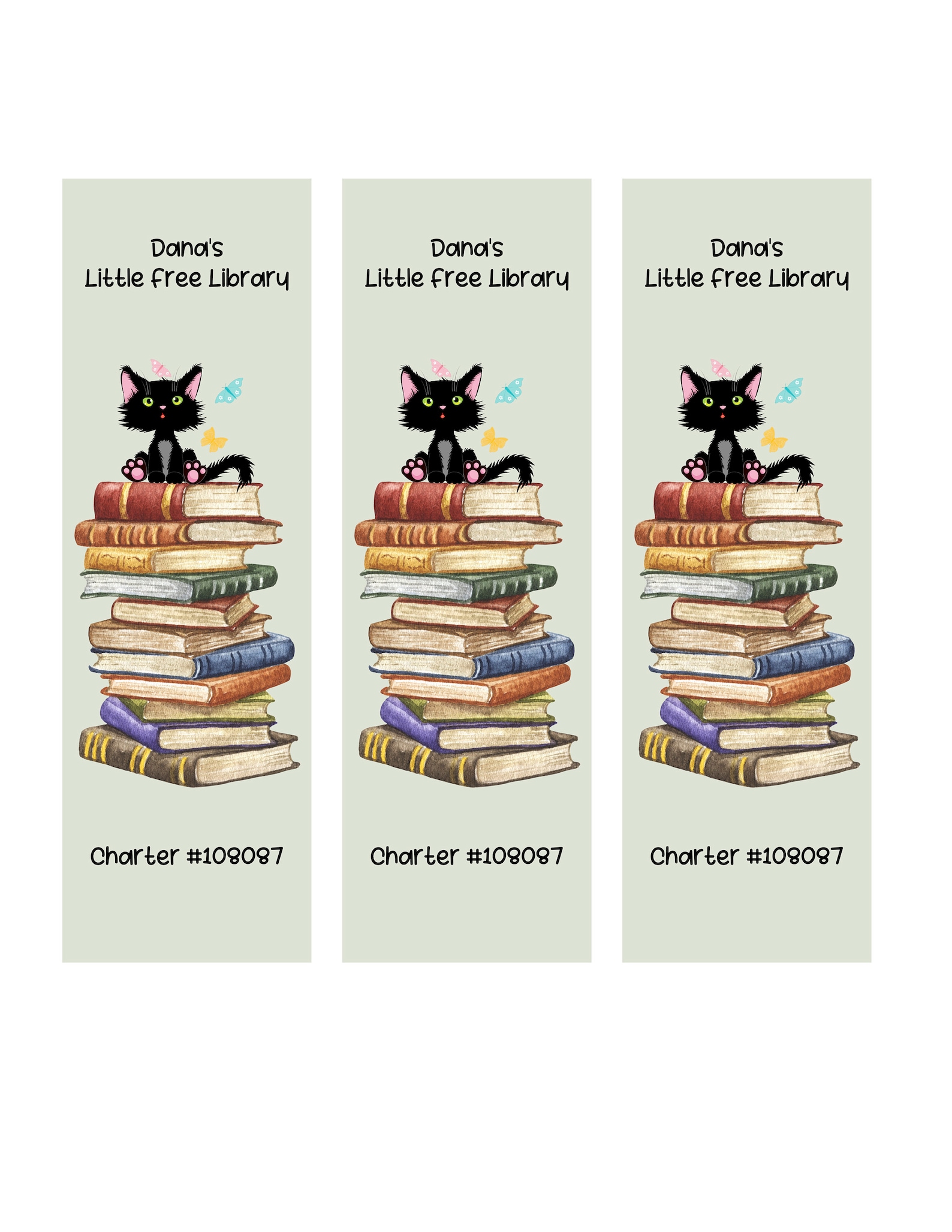 Set of bookmarks that can be customized to advertise your LFL, with a black cat on a stack of books.
